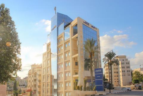 مبنى الإدارة العامة للبنك الوطني في رام الله بالأرقام، البنك الوطني يصبح ثالث أكبر بنك في فلسطين