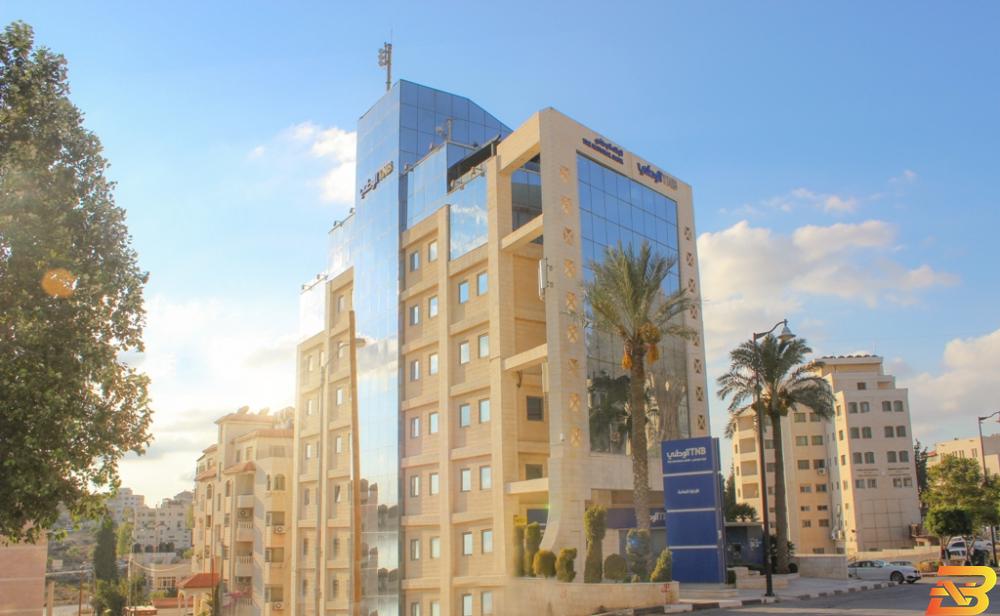 مبنى الإدارة العامة للبنك الوطني في رام الله بالأرقام، البنك الوطني يصبح ثالث أكبر بنك في فلسطين