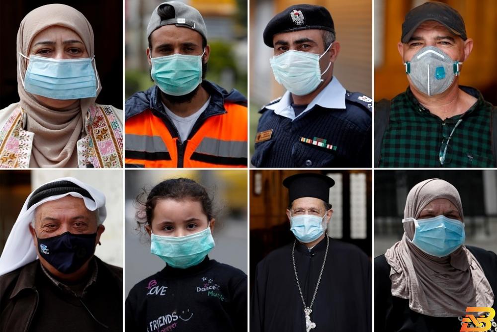 صورة توضيحية-فلسطينيون يرتدون الكمامات كإجراء للوقاية من فيروس كورونا-تصوير رويترز موظف حكومي؟ استئناف الدوام في 8 محافظات ابتداءً من الثلاثاء