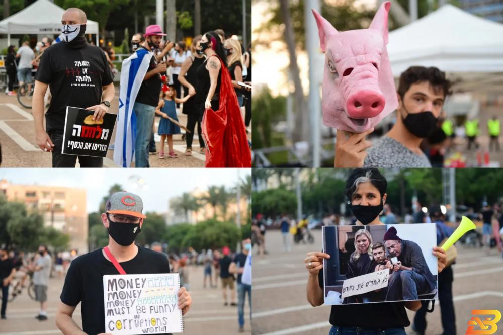 مشاركون في التظاهرة-تصوير وكالات 10 آلاف متظاهر وسط تل أبيب احتجاجا على الأوضاع الاقتصادية